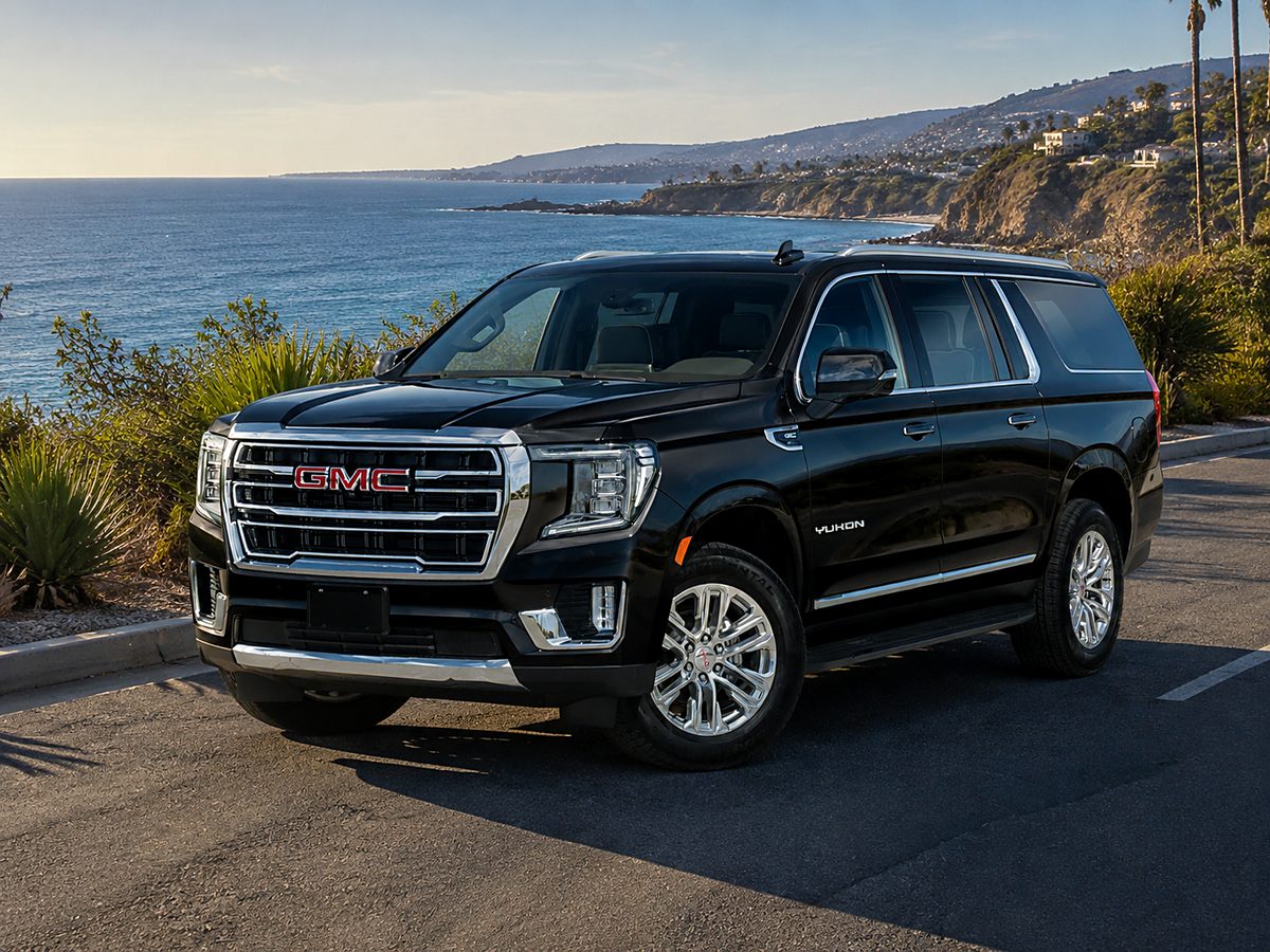 2024 GMC Yukon XL SLT in black, above the Pacific in Laguna Beach